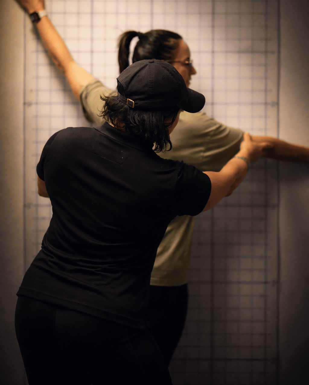 Karen Garrett performing postural alignment assessment